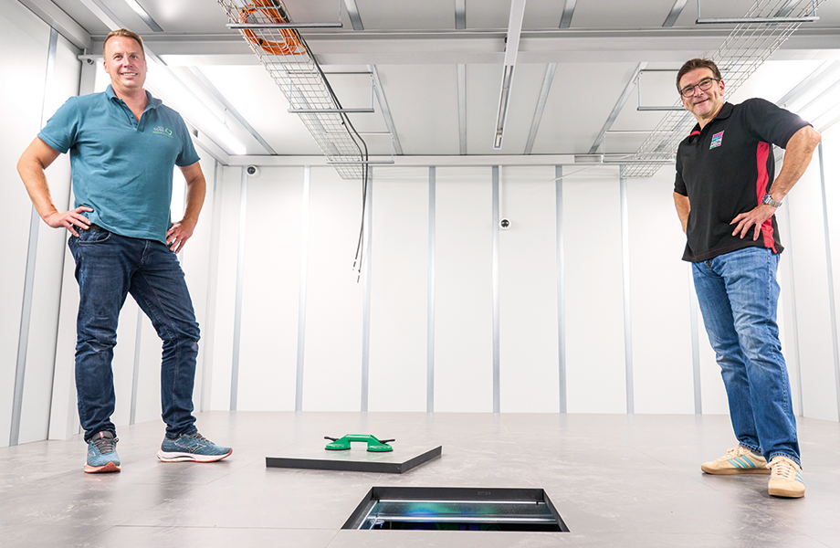 There is a raised floor for climate control purposes. Dr Fiete Dubberke (left) and Michael Nicolai in the Rittal security room, where the next stage will be to install the IT racks. (© Michael Koch/Digital Fotogroup)